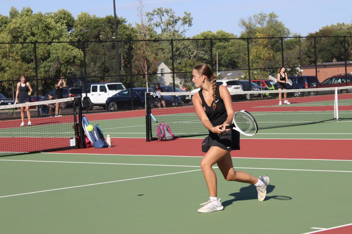 Senior Kate Grimm steps up to hit the ball against Chanhassen Sept. 17. Park hosted the Storm.