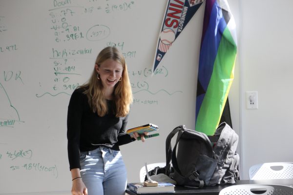 Senior Sylvia Tolzin works on an assignment in the newly remodeled A3 hallway Oct. 7. She utilizes the newly installed whiteboards to calculate and coordinate with her team.