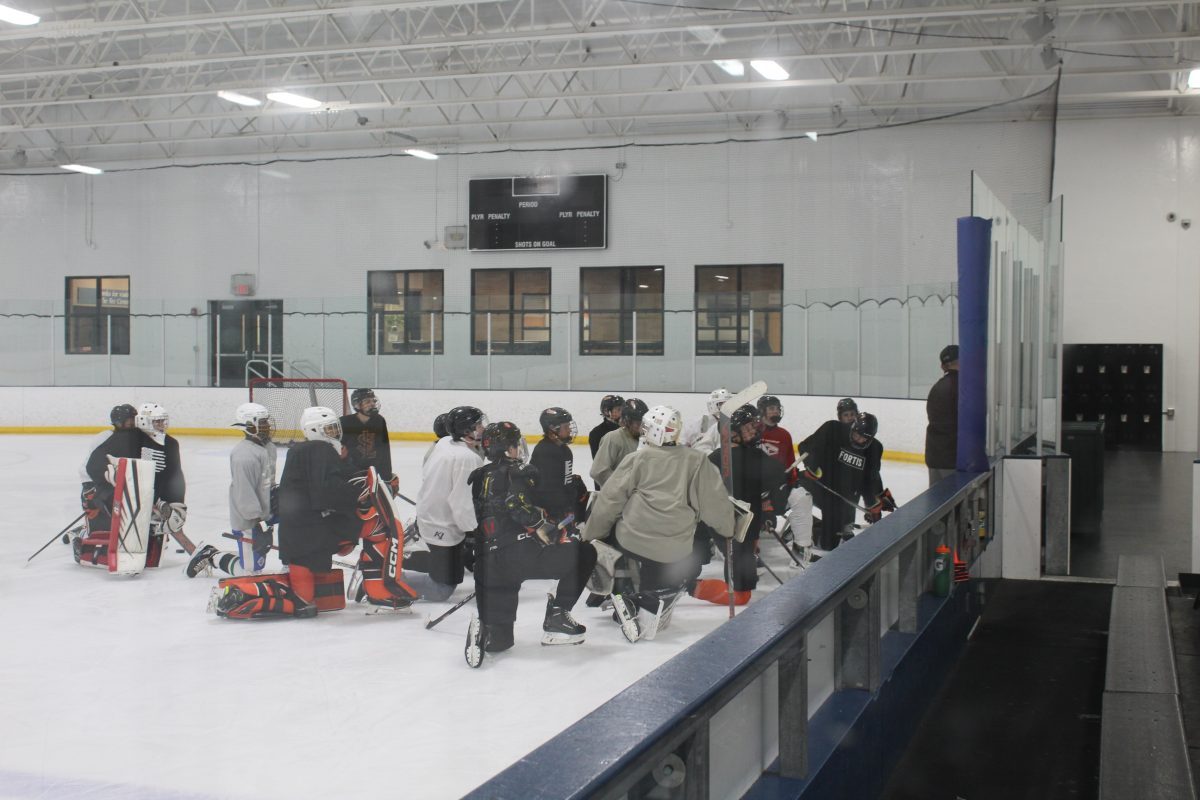 Park boys' hockey players listen to coach Timothy Donahue Oct. 1. The team holds practice three times a week in preparation for the season.