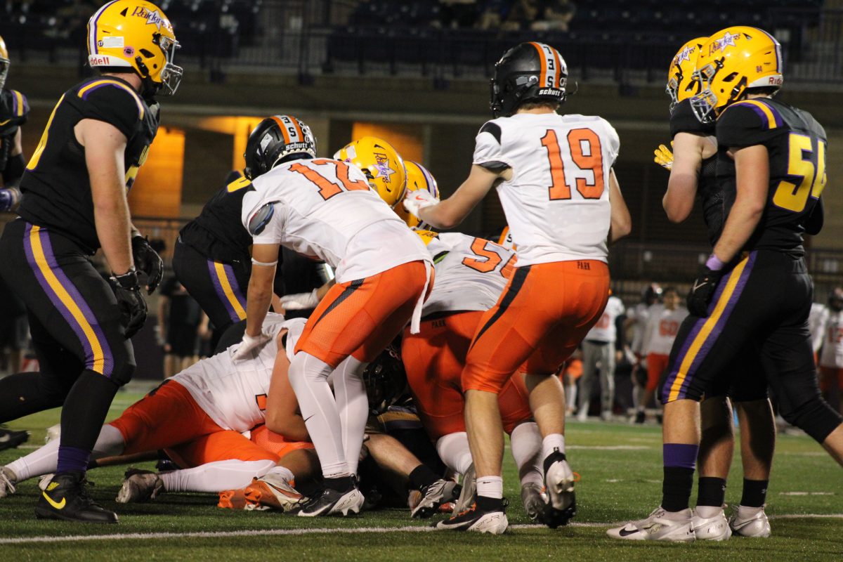 Park players fight for ball after fumble Oct. 10. Park falls to Cretin-Derham Hall 38-7.