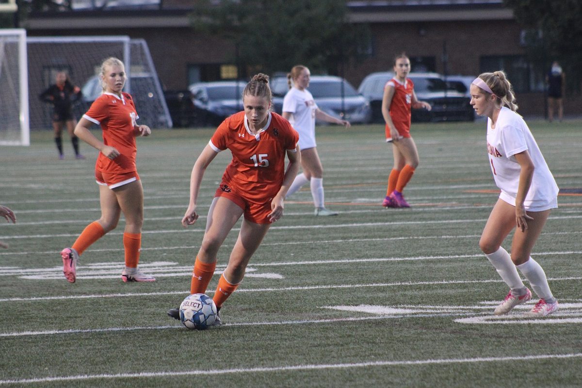 Junior Audrey Martin rushes up the field against the Waconia Wildcats Sept. 18. The game ended in a tie 1-1.