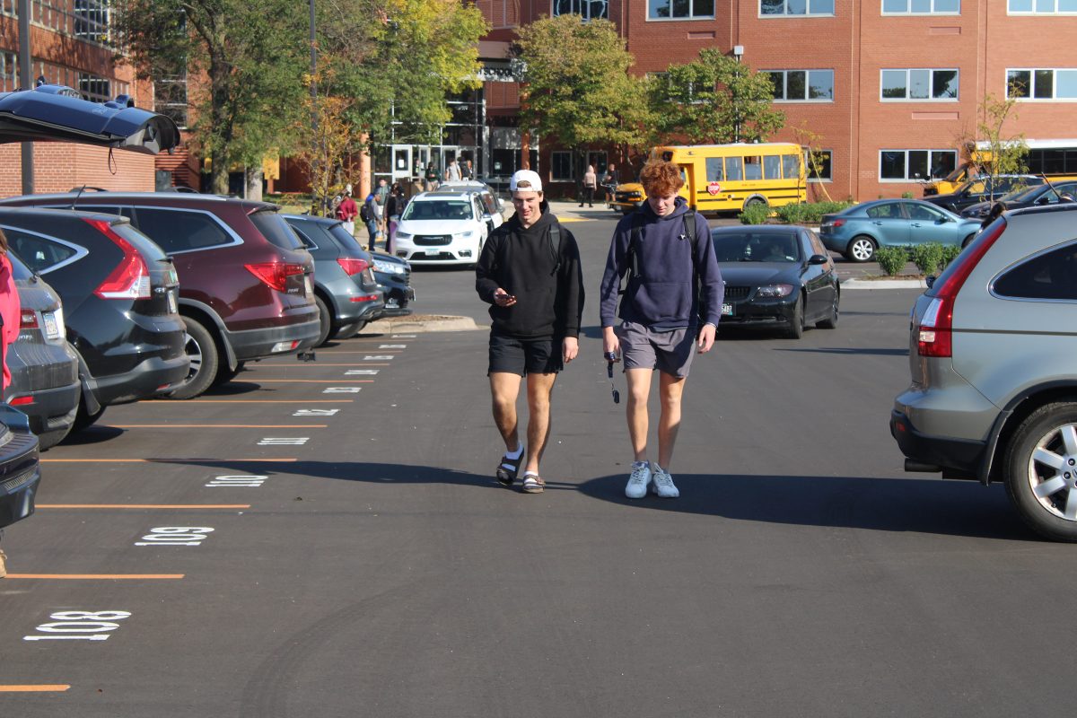 Seniors Louis Piper and Henry Berg walk to their cars after school Oct. 9. As of the 2024-2025 school year, Park has a newly renovated parking lot.