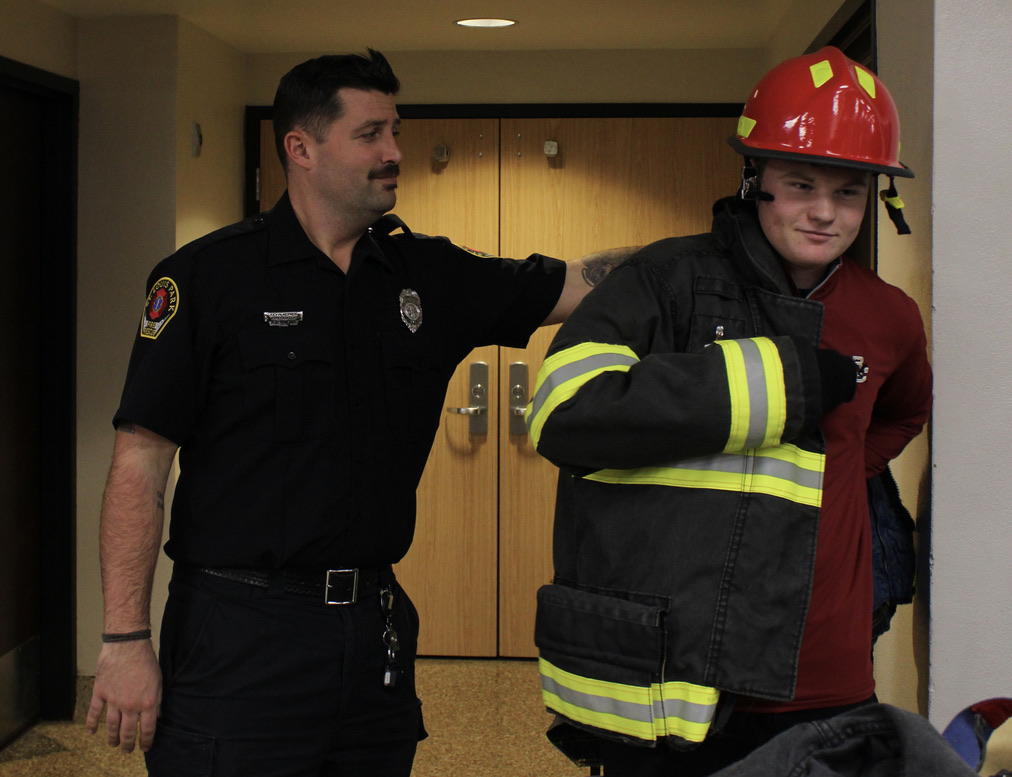 Junior Evan Scott prepares to fight the fire on Nov. 21. The career fair is a great opportunity for students to expand their horizons in the work industry.