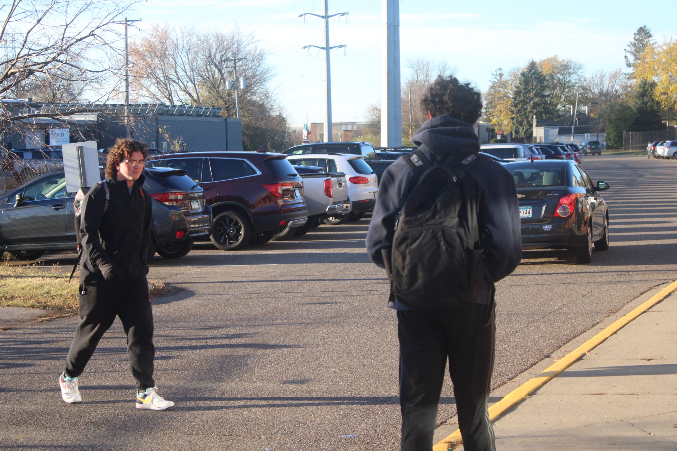 Junior Jaxon Grovier walks into school Nov. 8. New policies hope to prevent students from parking the wrong lots.