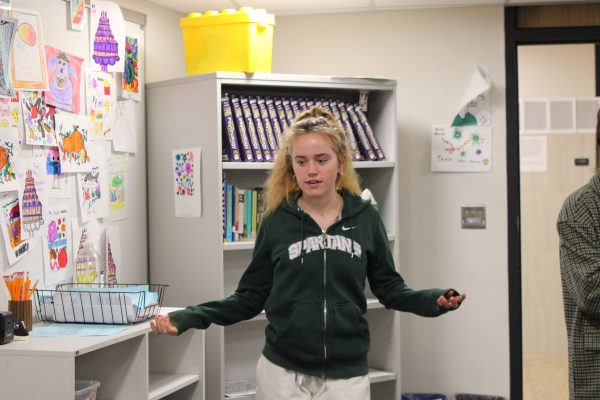 Girls United President Sela Myers gives instructions to club members Nov.13. The club met to discuss Native American History Month.