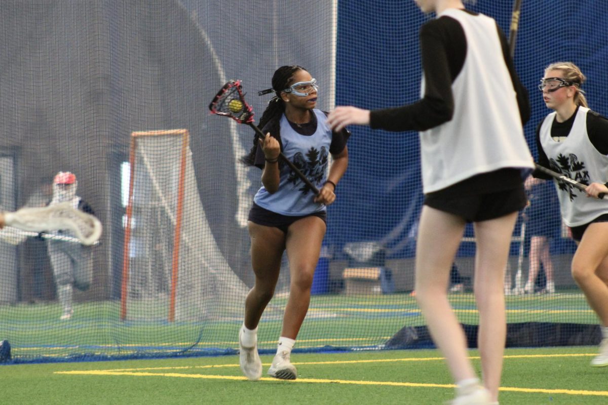 Senior Tamara Smith looks to drive during Chillax scrimmage Nov. 17. Chillax is a winter lacrosse league to help prepare the players for the spring season.