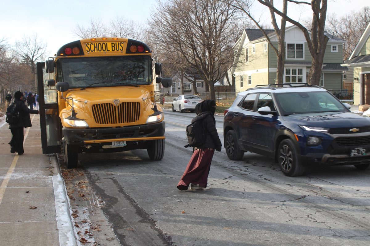 School buses park on the side of the road Dec. 9. Due to a lack of space in the bus corral, buses must park on the street.