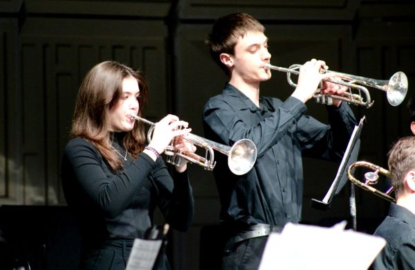 Juniors Ellanor Foreman and Lucas Collinet play the trumpet during the jazz band concert on Dec. 10. The concert was held at Park high school's auditorium.