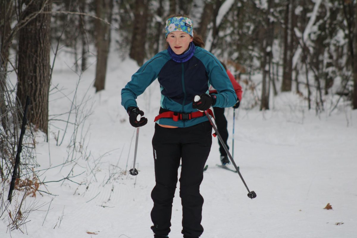 Junior Kaylee Crump finishes skiing one of the various ski trails in Ironwood, Michigan Dec. 7. Park's Nordic team went on their annual ski trip Dec 6, 7 and 8.