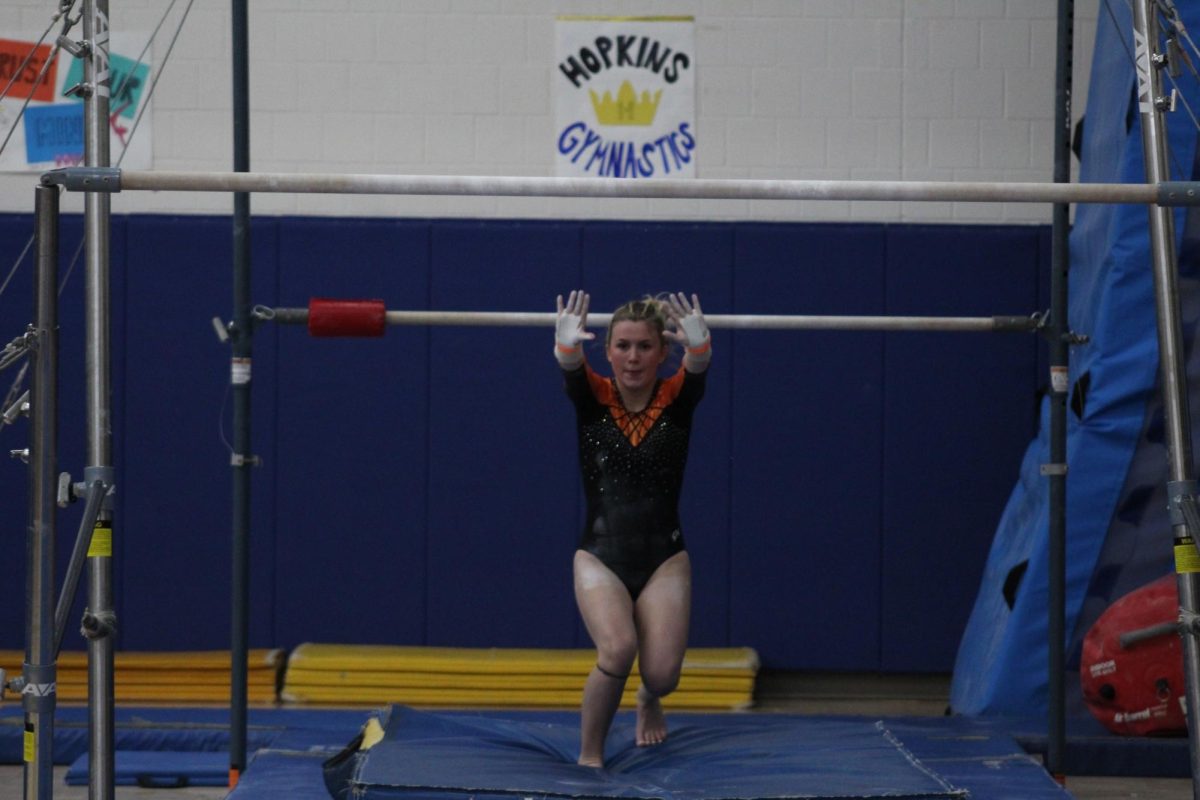 Junior Elsa Crow finishes her bar routine at the meet Dec. 5. This was Park's first meet of the season.