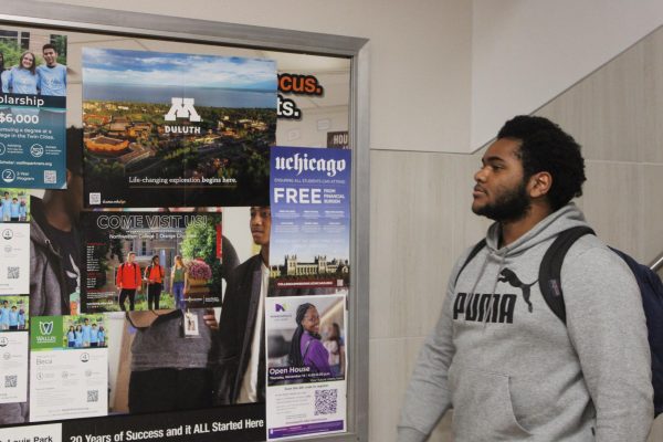 Senior Isaiah Brown walks past the college and career board Nov. 25. Park seniors have begun filling out the FAFSA as they think about college options.