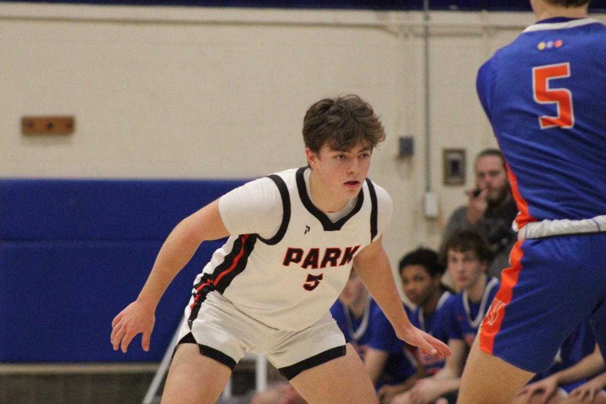 Junior Josh Rickord steps up to guard a Washburn player Jan. 4. Park ends with a loss of 80-75 against the Washburn Millers.