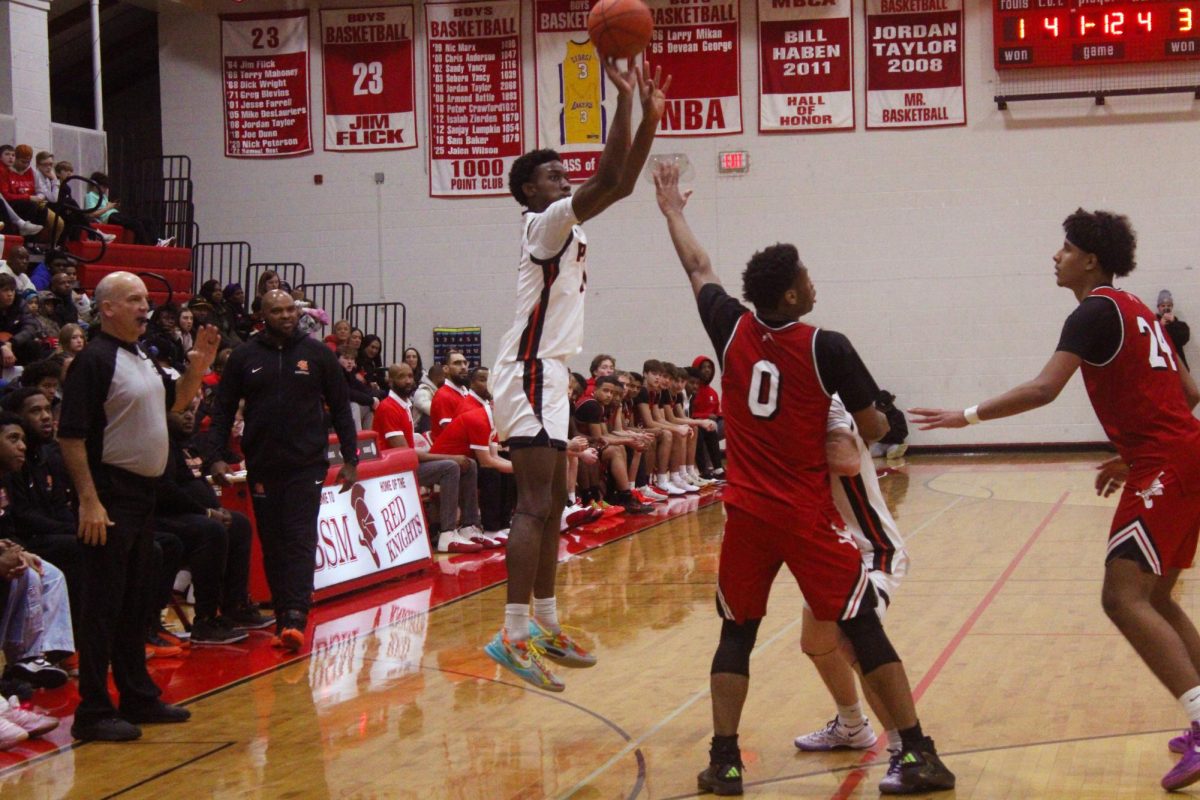 Sophomore Matthew Johnson shoots a three-pointer Jan. 14. Park lost to Benilde-St. Margret's 68-78.