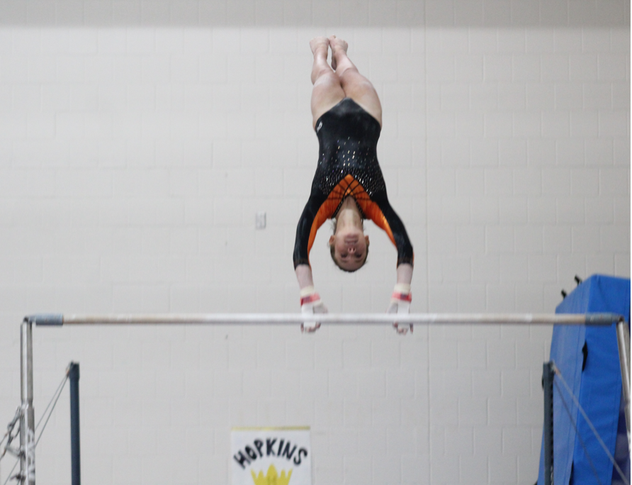 Junior Veronica Jones performs her bar routine Dec. 5. Jones is one of Park's girls gymnastics captains.