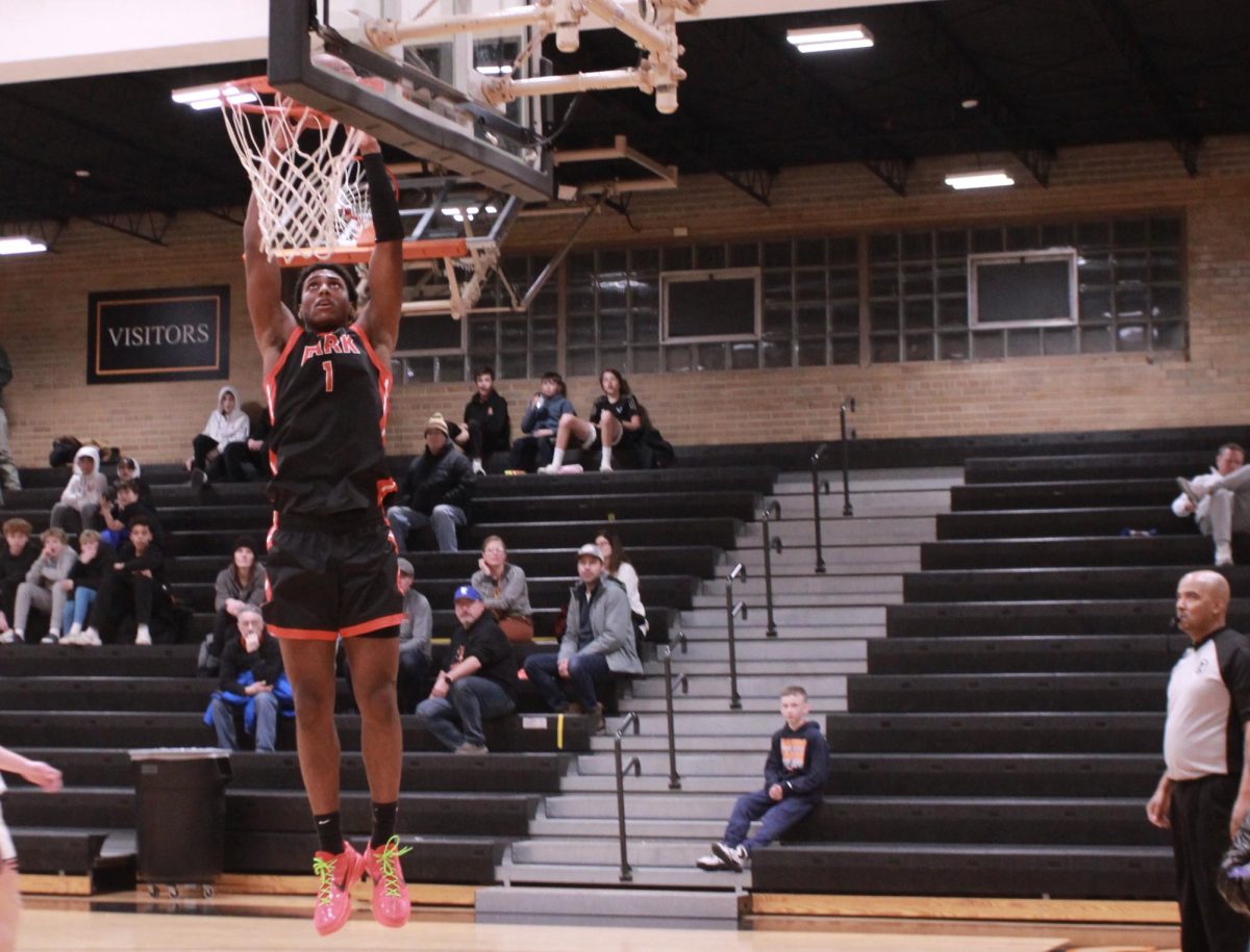 Senior Micah Curtis dunked on New Prague's hoop Jan. 21. Curtis dunked on every opportunity he had available.