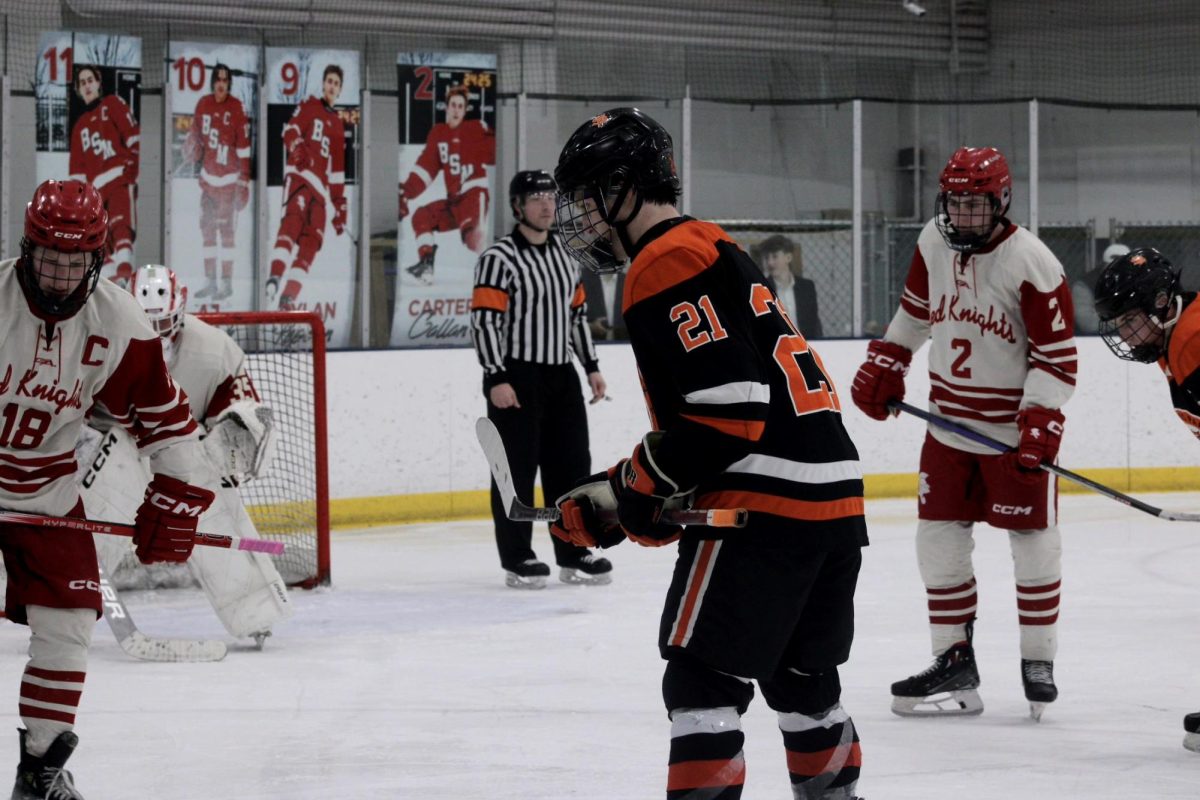 Junior center Marty Hirte gets ready to set up in a face off against the Benilde-St. Margaret's Red Knights. Park ends with a loss after a game against hometown rivals Feb. 1.