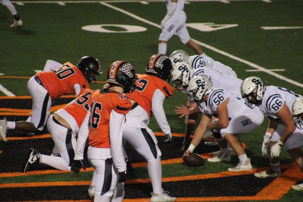 Park sets up their defensive line against St. Francis Fighting Saints on the snap at their home stadium Oct. 15. Park was at the 50-yard line for most of the game, putting both Park and St. Francis at an even match to get to their end zones.