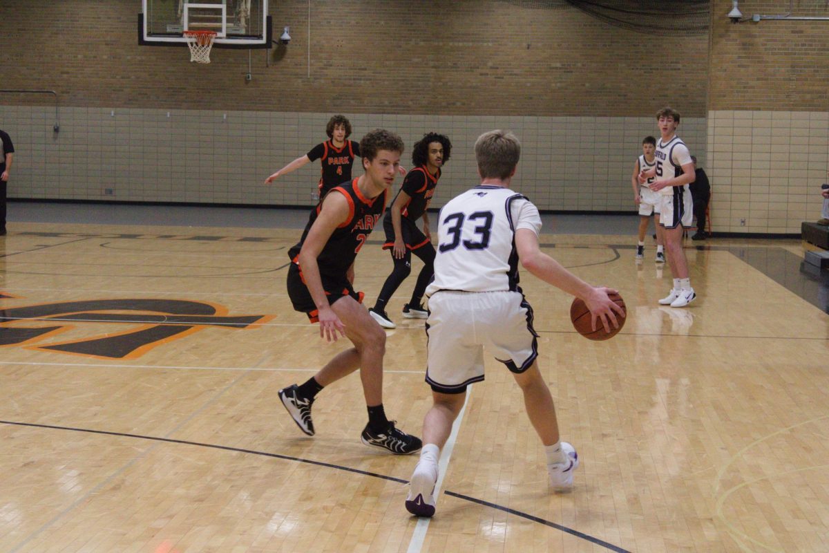 Senior Jacob Natzel guards Buffalo High School forward during a full-court press against Buffalo on Dec. 12. Park lost 70-66 after a close second half,