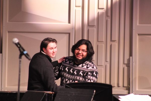 Choir students Elliott Netoff and Alexander Castro participate in a partner dance segment during the song “Slow Dancing in the Snow” Dec. 15. The piece, composed by Jay Althouse, combined winter imagery with upbeat melodies, making it a perfectly on-theme addition to the performance.