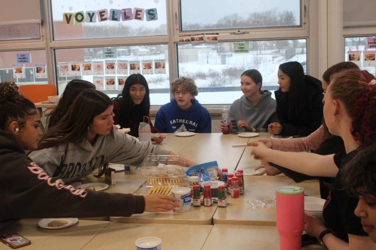Students decorate cookies in potluck club Dec. 18. The potluck club meets every other Thursday in room B230.