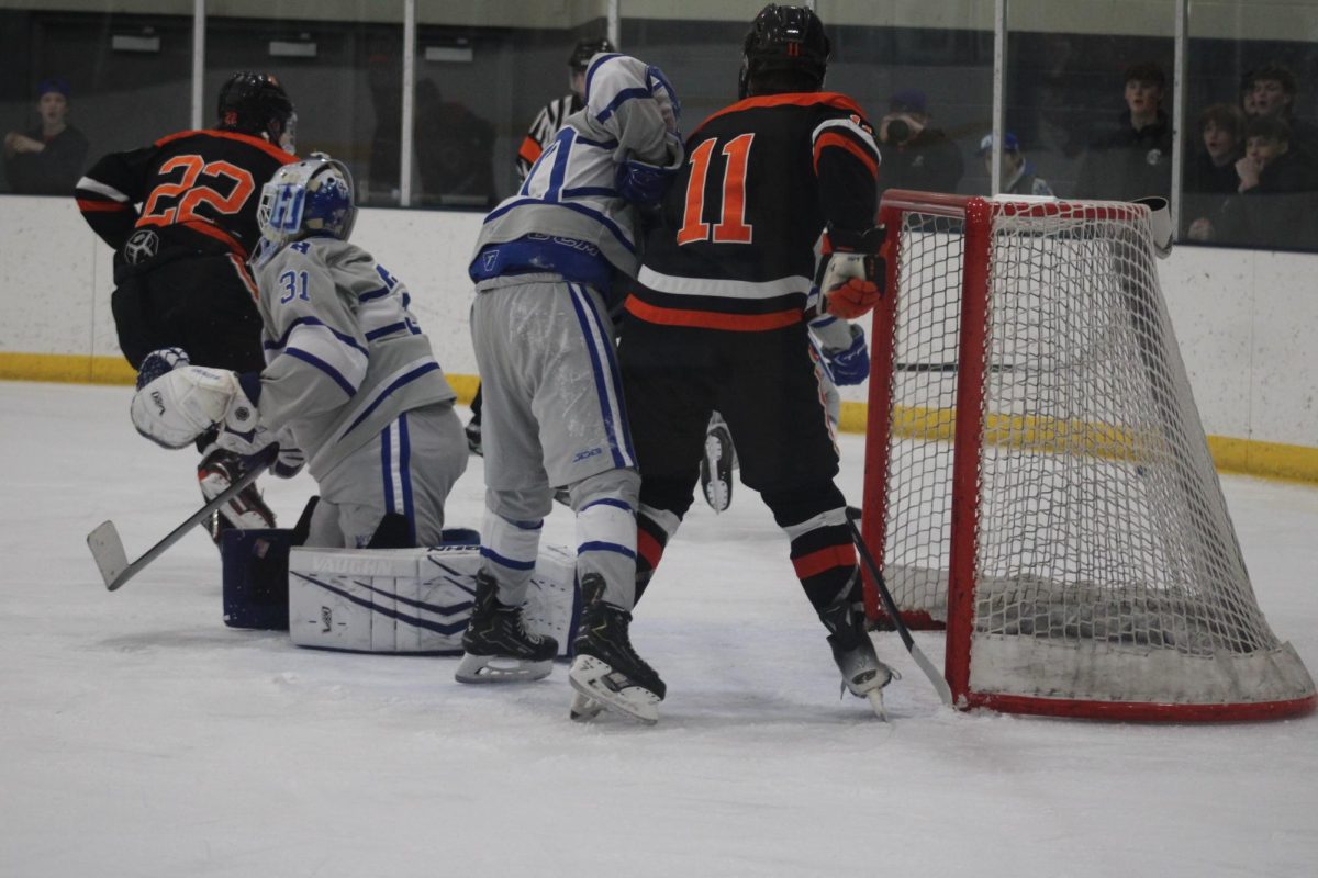Junior Liam McCoy posts up in front of Hopkins' goal Jan. 8. McCoy puts pressure on the Hopkins goalie and defense.