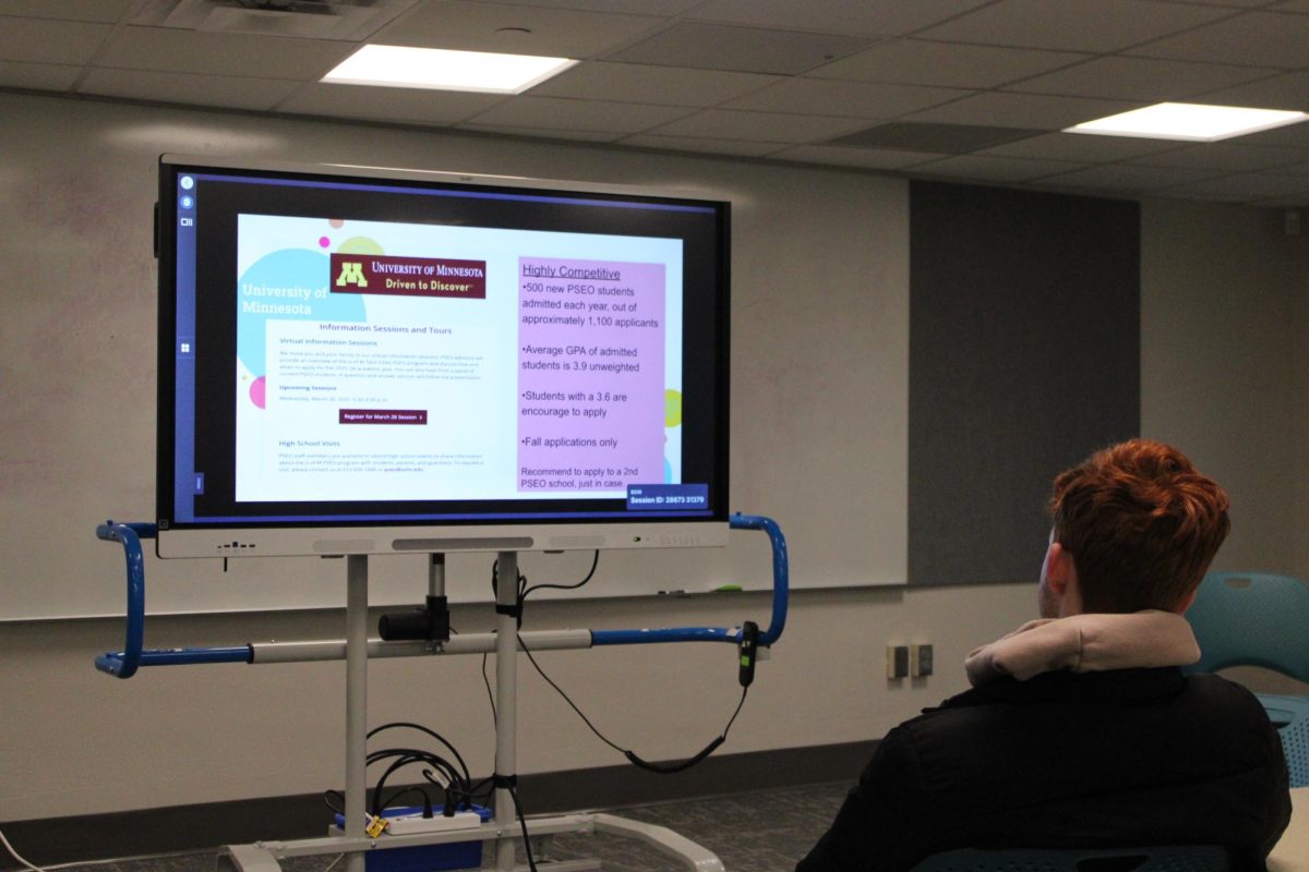 Junior Wes Margraff listens to a presentation about the PSEO program for the University of Minnesota during an interest meeting on Thursday, Nov. 20. This was the last interest meeting regarding registering for the second semester of the 26-27 school year.