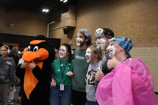 Teachers and Park’s mascot, the Oriole, stand for a photo after getting pied May 6. The pep fest aims to raise spirits for prom. 