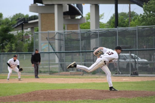 Junior Wes Marggraf follows through on the mound after a pitch against Edina May 22. The Orioles will face the hornets again next week in the section tournament.