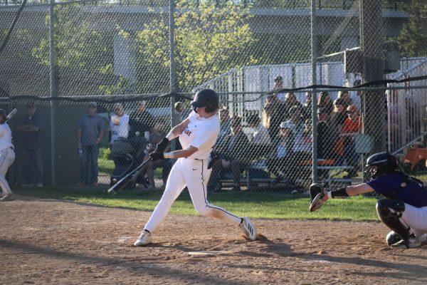 Senior Grant Haggerty swings at a baseball May 13. Park lost this game 5-10.