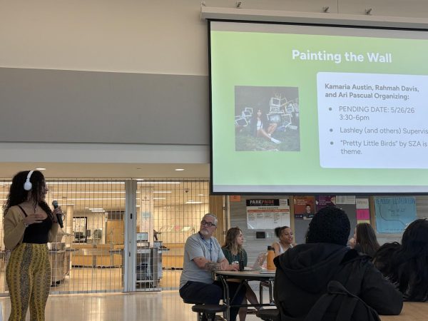 Senior Rahmah Davis presents the design idea for the annual senior tradition of painting a wall May 13. The design was made by Davis alongside seniors Ari Pascual and Kamaria Austin and will reflect a “Pretty Little Birds” by SZA theme.