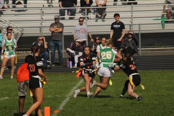 Senior Syd McGary-Walters lunges towards the Edina player on May 10th. The Orioles flag football team played Southwest and Edina back-to-back.